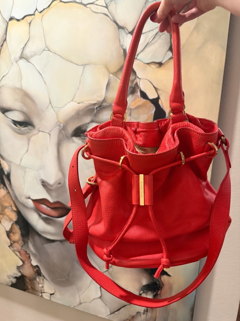 See By Chloe orange red bucket bag purse with gold colored hardware